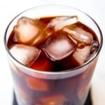 square hero image of a glass of cold brew coffee over ice.