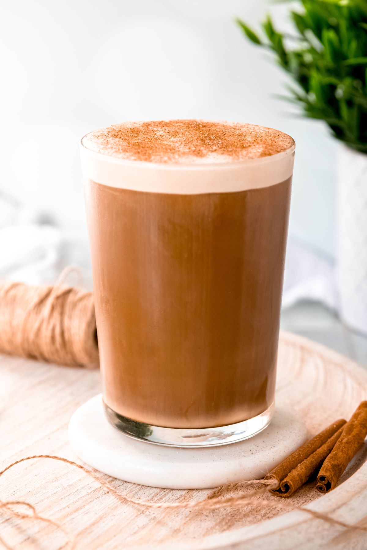 A close up shot of a tall glass of Starbucks cinnamon caramel cream cold brew copycat recipe.