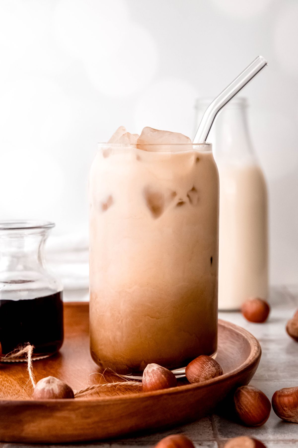 side on shot of an ombre hazelnut iced oat milk shaken espresso.