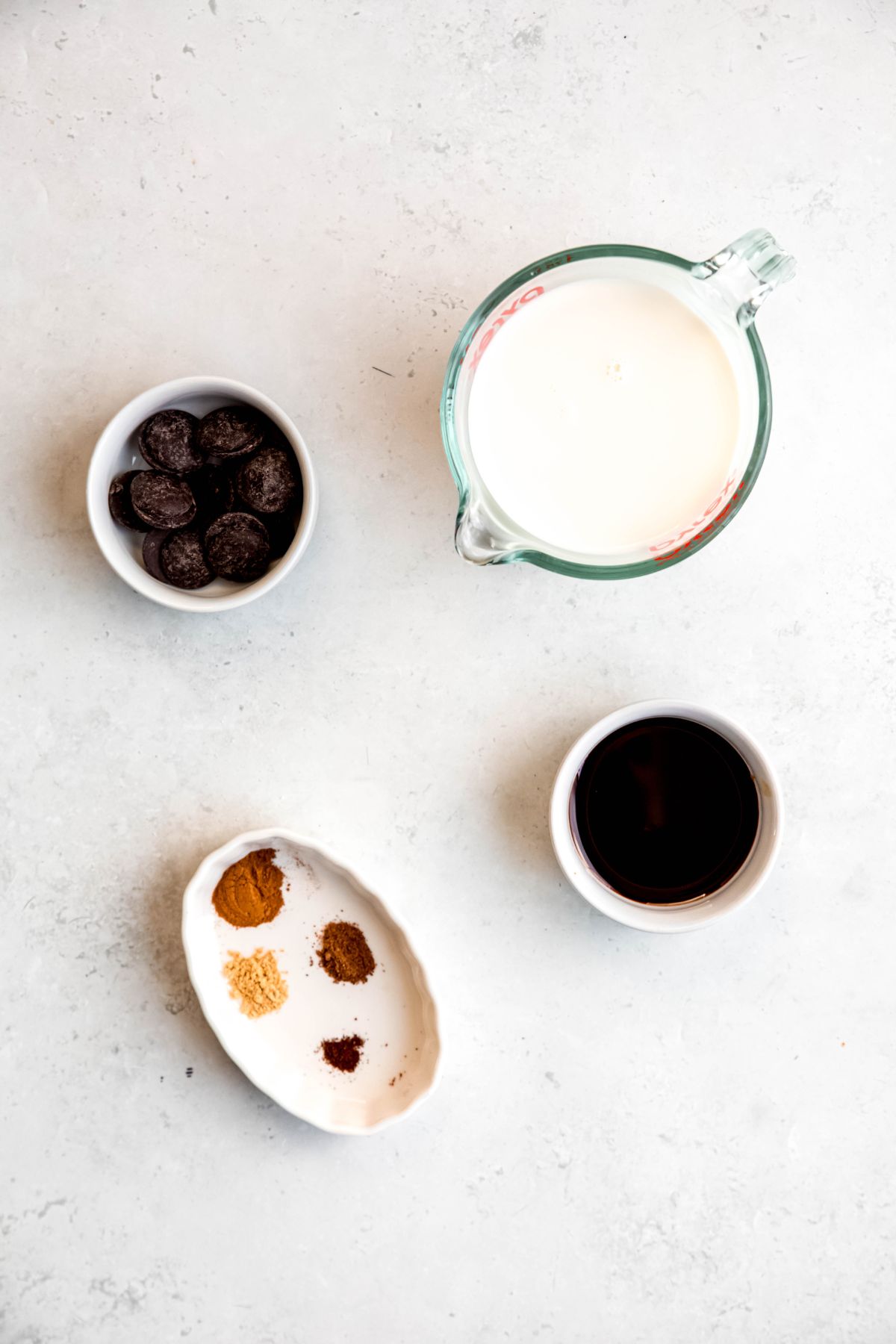 All the ingredients needed to make gingerbread hot chocolate on the counter. 