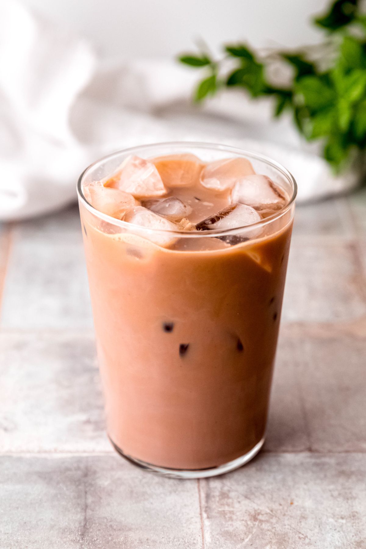 A close-up shot of a glass of chocolate iced protein coffee on the counter. 