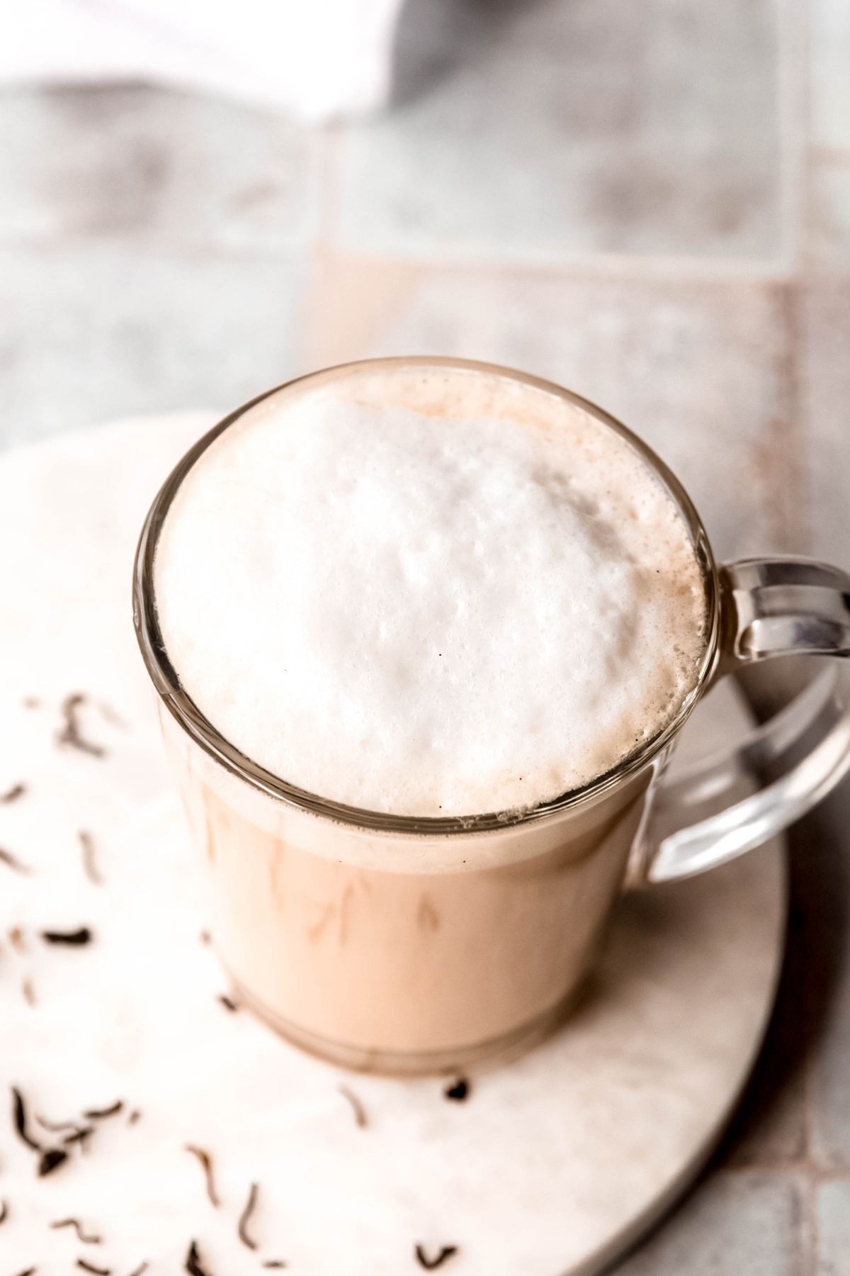 45 degree overhead shot showing the fluffy foam on top of an earl grey latte.