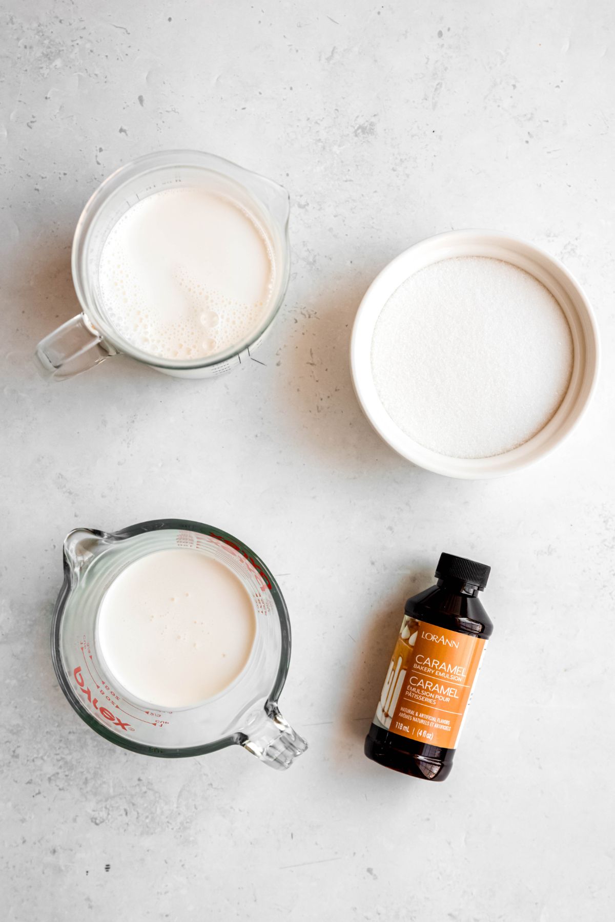 ingredients needed to make copycat Starbucks caramel macchiato coffee creamer recipe measured out on a white table. 